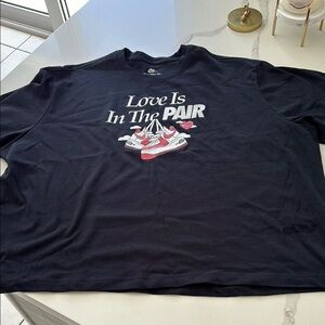 Black Graphic Tee with Red and White Sneakers Design